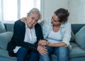 Mother and daughter crying at home in quarantine grieving loss of family members amid COVID-19 Royalty Free Stock Photo