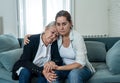 Mother and daughter crying at home in quarantine grieving loss of family members amid COVID-19 Royalty Free Stock Photo