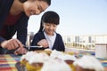 Mother and daughter decorating cupcakes