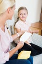 Mother with daughter discussing menstruation and sanitary products Royalty Free Stock Photo