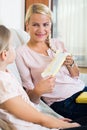 Mother with daughter discussing menstruation and sanitary products Royalty Free Stock Photo