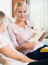 Mother with daughter discussing menstruation and sanitary products Royalty Free Stock Photo