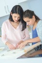 mother and daughter doing baking Royalty Free Stock Photo