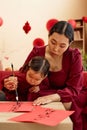 Mother and Daughter doing Calligraphy Royalty Free Stock Photo