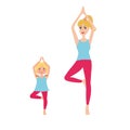 Mother and daughter doing yoga.