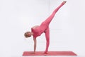 Beautiful blonde engaged in yoga relaxes and meditation