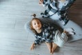 Mother and daughter doing yoga exercise on floor in gym. Top view Royalty Free Stock Photo