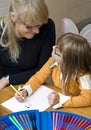 Mother and daughter drawing together Royalty Free Stock Photo