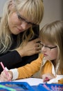 Mother and daughter drawing together