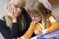 Mother and daughter drawing together Royalty Free Stock Photo