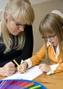 Mother and daughter drawing together