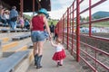 Mother and daughter dressed for Canada Day walked through stands