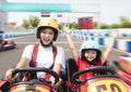 Mother and daughter driving go kart on the track Royalty Free Stock Photo