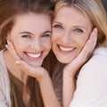 Mother, daughter and embrace with smile, closeup and love for happiness outside. Women, motherhood and mom for growth