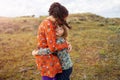 Mother and daughter embracing outdoors