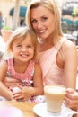 Mother And Daughter Enjoying Cup Of Coffee Royalty Free Stock Photo