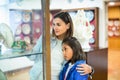 Mother and daughter enjoying expositions of previous centuries Royalty Free Stock Photo