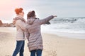 Mother and daughter enjoying sunset on the beach Royalty Free Stock Photo