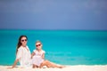 Mother and daughter enjoying time at tropical beach in caribbean vacation Royalty Free Stock Photo