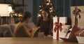 Mother and daughter exchanging Christmas gifts