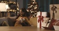 Mother and daughter exchanging Christmas gifts