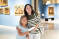 Mother and daughter exploring expositions in museum Royalty Free Stock Photo