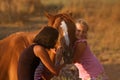 Mother and daughter feeding her handsome horse Royalty Free Stock Photo