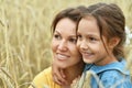 Mother with daughter on field