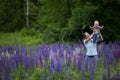 Mother & Daughter in Field of Lupine Flowers