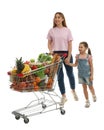 Mother and daughter with full shopping cart on white background Royalty Free Stock Photo