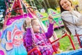 Mother and daughter at fun fair, chain swing ride Royalty Free Stock Photo