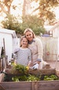 Mother, daughter and gardening with portrait in home for bonding, happy family and organic hobby. Woman, girl child and Royalty Free Stock Photo