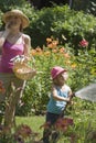 Mother and daughter gardening together