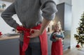 Mother and daughter getting ready for Christmas baking