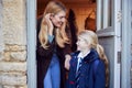 Mother And Daughter Getting Ready To Leave Home For School In The Morning Standing By Door Royalty Free Stock Photo