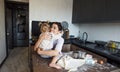 a happy mother and a girl daughter cook cookies and have fun in the kitchen. Homemade food and a little helper. Royalty Free Stock Photo