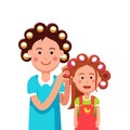 Mother and daughter girl doing curly hairstyle