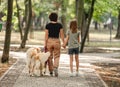 Mother and daughter with golden retriever dog Royalty Free Stock Photo