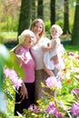 Mother, daughter and grandmother enjoying walk in the park Royalty Free Stock Photo