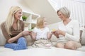 Mother, Daughter, Grandmother Family Drinking Tea Royalty Free Stock Photo