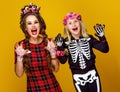 Mother and daughter in halloween costume frightening