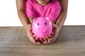 Mother and daughter hand holding piggy bank isolated on white background with clipping path. Savings concepts Royalty Free Stock Photo