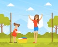 Mother and Daughter Hanging Wet Clothes out to Dry on Backyard Cartoon Vector Illustration Royalty Free Stock Photo