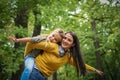 Mother and daughter have playing together outside.