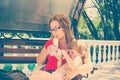 Mother and daughter having breakfast outdoors. Royalty Free Stock Photo