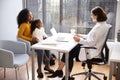 Mother And Daughter Having Consultation With Female Pediatrician In Hospital Office Royalty Free Stock Photo