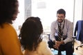 Mother And Daughter Having Consultation With Male Pediatrician In Hospital Office Royalty Free Stock Photo