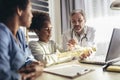 Mother And Daughter Having Consultation With Male Pediatrician In Doctor`s Office Royalty Free Stock Photo