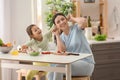 Mother and daughter having fun while cooking in kitchen Royalty Free Stock Photo