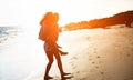 Mother and daughter having fun on ocean beach - Mum playing with her kid in holiday vacation next to the ocean - Family lifestyle Royalty Free Stock Photo